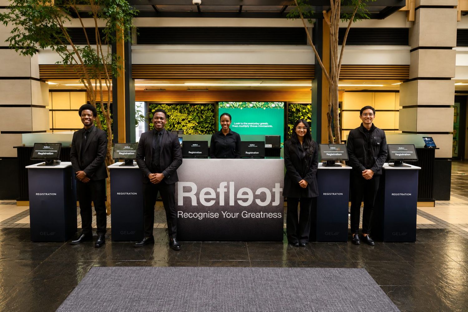 GEL Events branded self-service check-in kiosks and staff at the Reflect event